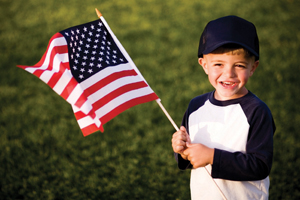 child-holding-american-flag